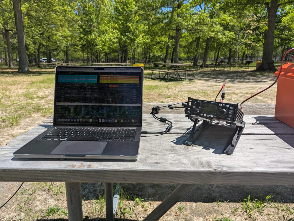 Ham radio portable setup with Xiegu G90 and laptop on picnic table at Belmont Lake State Park